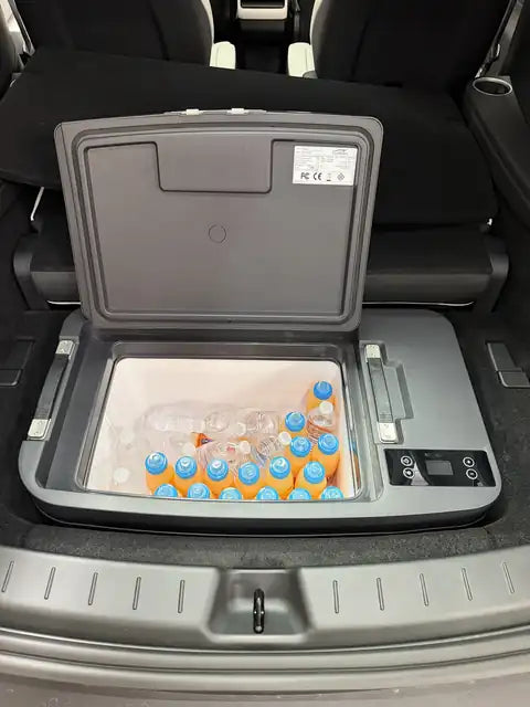 CarFrozen Fridge Y with the lid open and filled with drinks in a Tesla Model Y L sub-trunk
